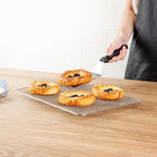 Restaurantware Met Lux 9.8 x 14.8 Inch Wire Baking Rack 1 Heavy-Duty Oven Wire Rack - Fits Jelly Roll Pan Dishwashable Stainless Steel Cooling Rack Elevated Feet Oven-Ready Up To 575F