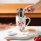 Sweejar Porcelain Tea Mug with Infuser and Lid,Teaware with Filter, Loose Leaf Tea Cup Steeper Maker, 16 Fl Oz for Tea/Coffee/Milk/Women/Office/Home/Gift (Plum Blossom)