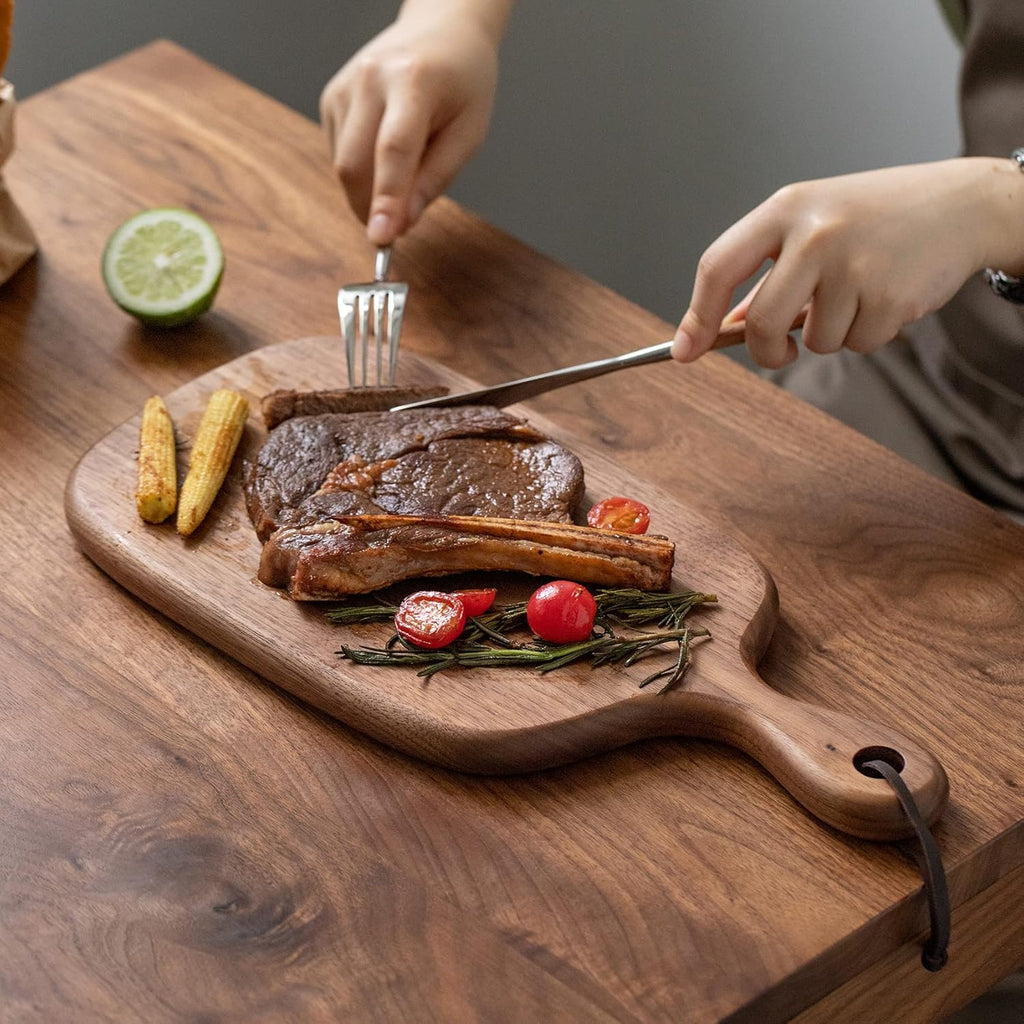 Muso Wood Small Cutting Board with Handle, Walnut Wooden Chopping Boards for Bread, Vegetables & Fruits, Dinner Cheese Board with Hole(15.2x7.3 Inches)