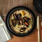 Gibson Elite Deerfield 16-Piece Stoneware Dinnerware Set – Matte Black Reactive Glaze Plates and Bowls, Stackable, Modern Design, Service for 4 – Microwave & Dishwasher Safe